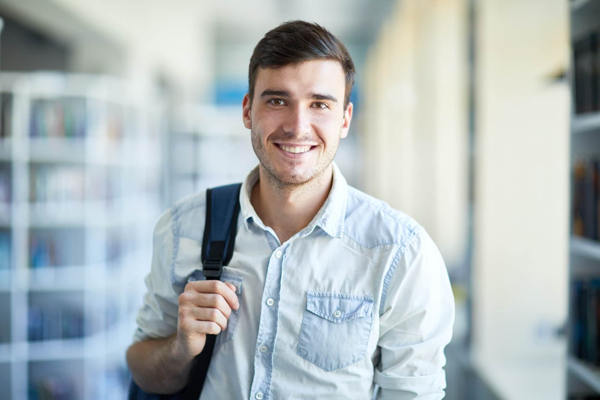Smiling handsome guy with satchel
